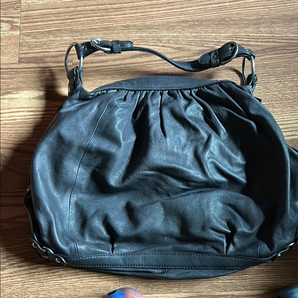 Black goat skin Juicy Couture shoulder bag.